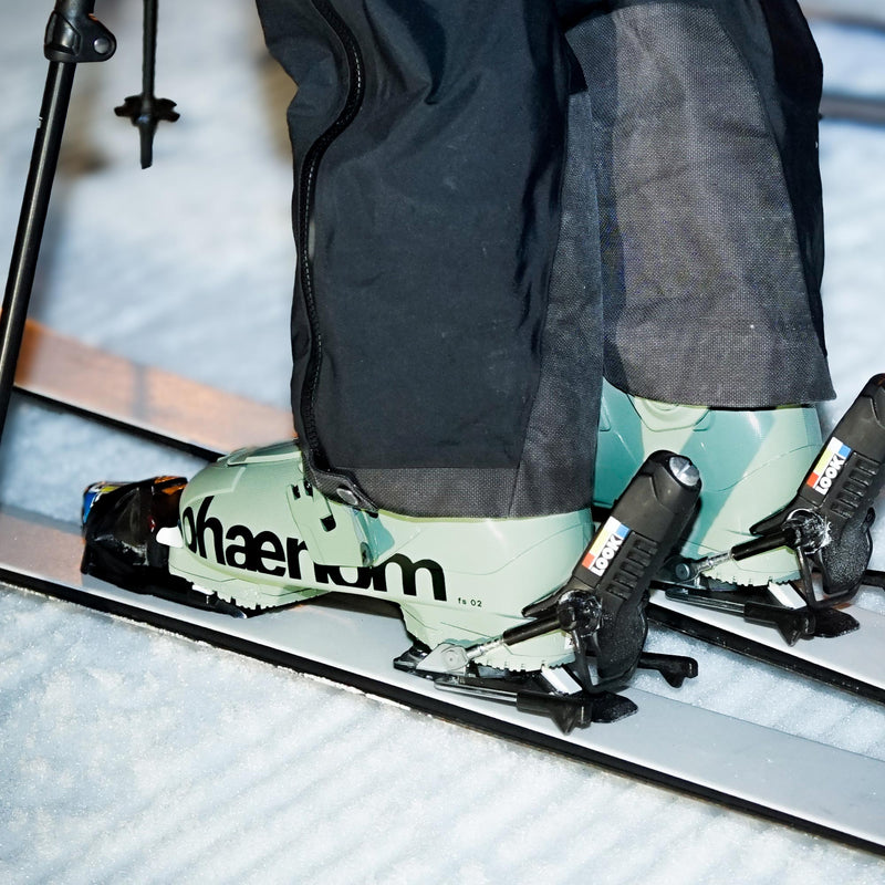 Person standing with faction skis on and phaenom fs 02 90 freestyle and all mountain ski boots
